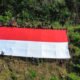 Merah Putih Raksasa Berkibar di Perbatasan RI–Malaysia, Kobarkan Nasionalisme di Bukit Tempayan